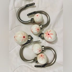 Pottery Barn kids ceramic white/pink daisy curtain rod finials and holdbacks.